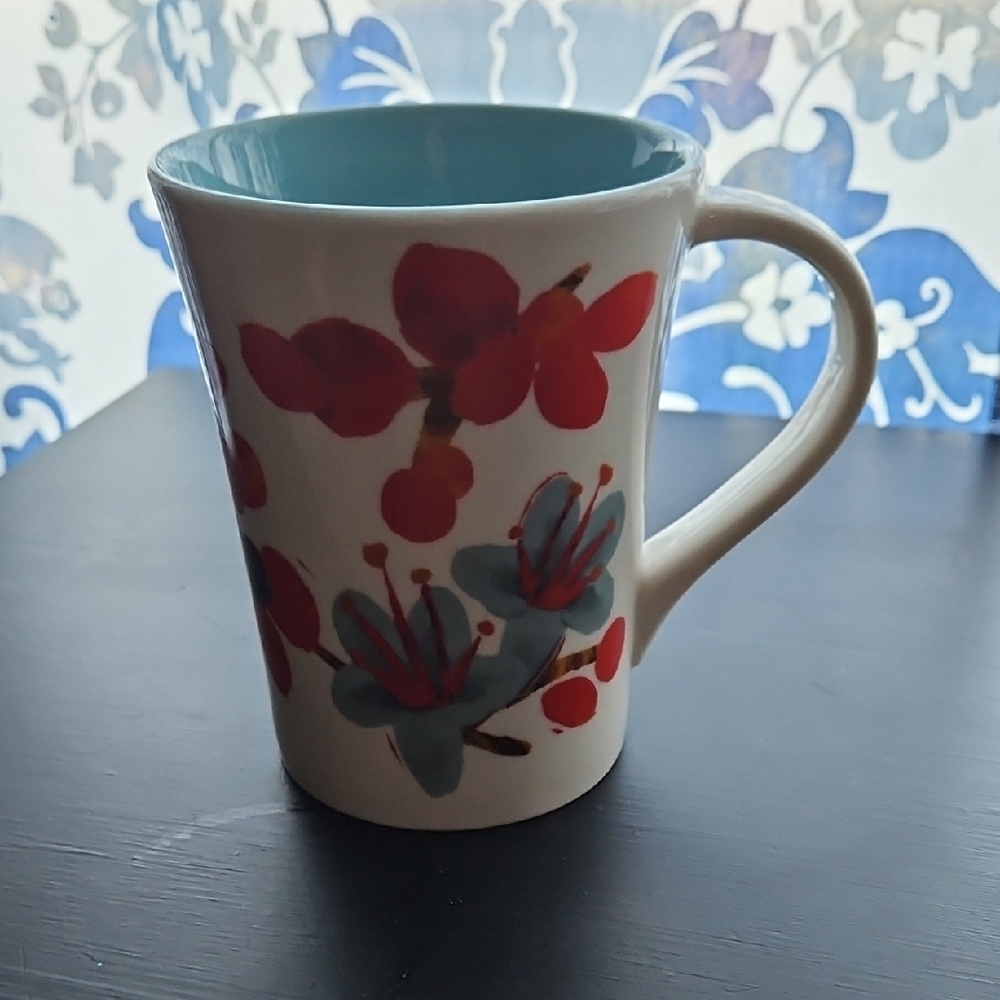 Starbucks White Ceramic Mug with Blue Floral Pattern and Red Accents